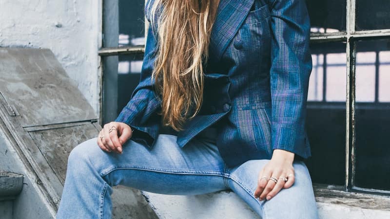 Vibrant African fashion designs on the runway with dramatic stage lighting