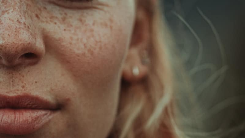 African businesswoman in vibrant clothing working in her textile workshop